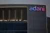 अडानी ग्रुप की तीन कंपनियों अडानी ग्रीन, अडानी ट्रांसमिशन और अडानी पोर्टस को लगा बड़ा झटका 